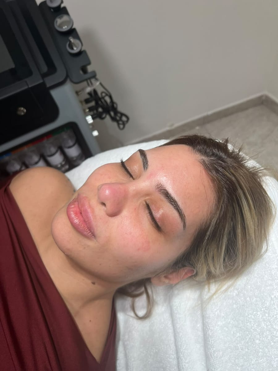 Client relaxing during a skin care session at Nourél Beauty Center